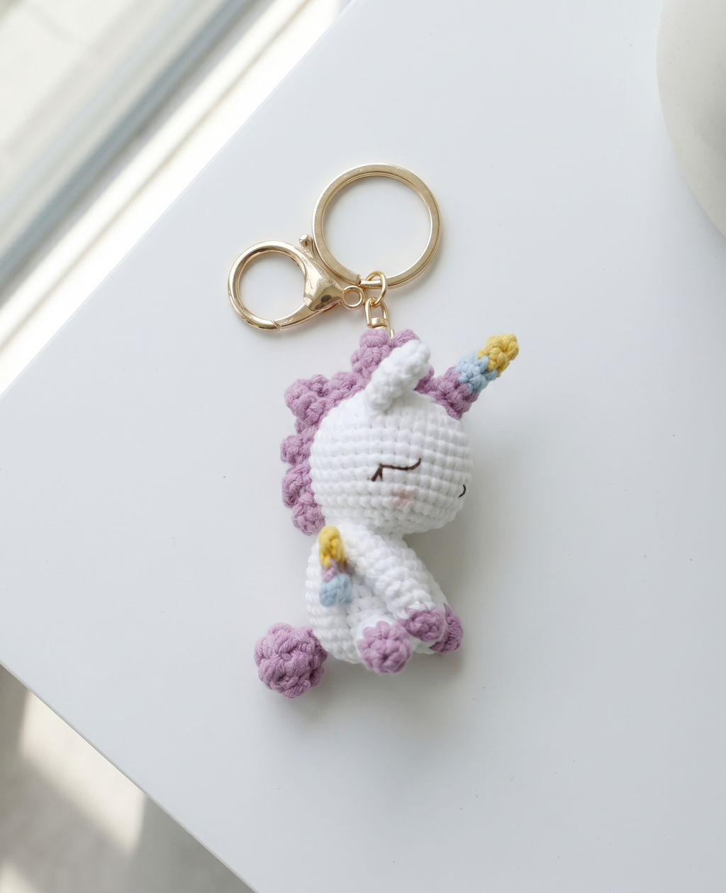 Crochet unicorn keyring showing horn and mane detail