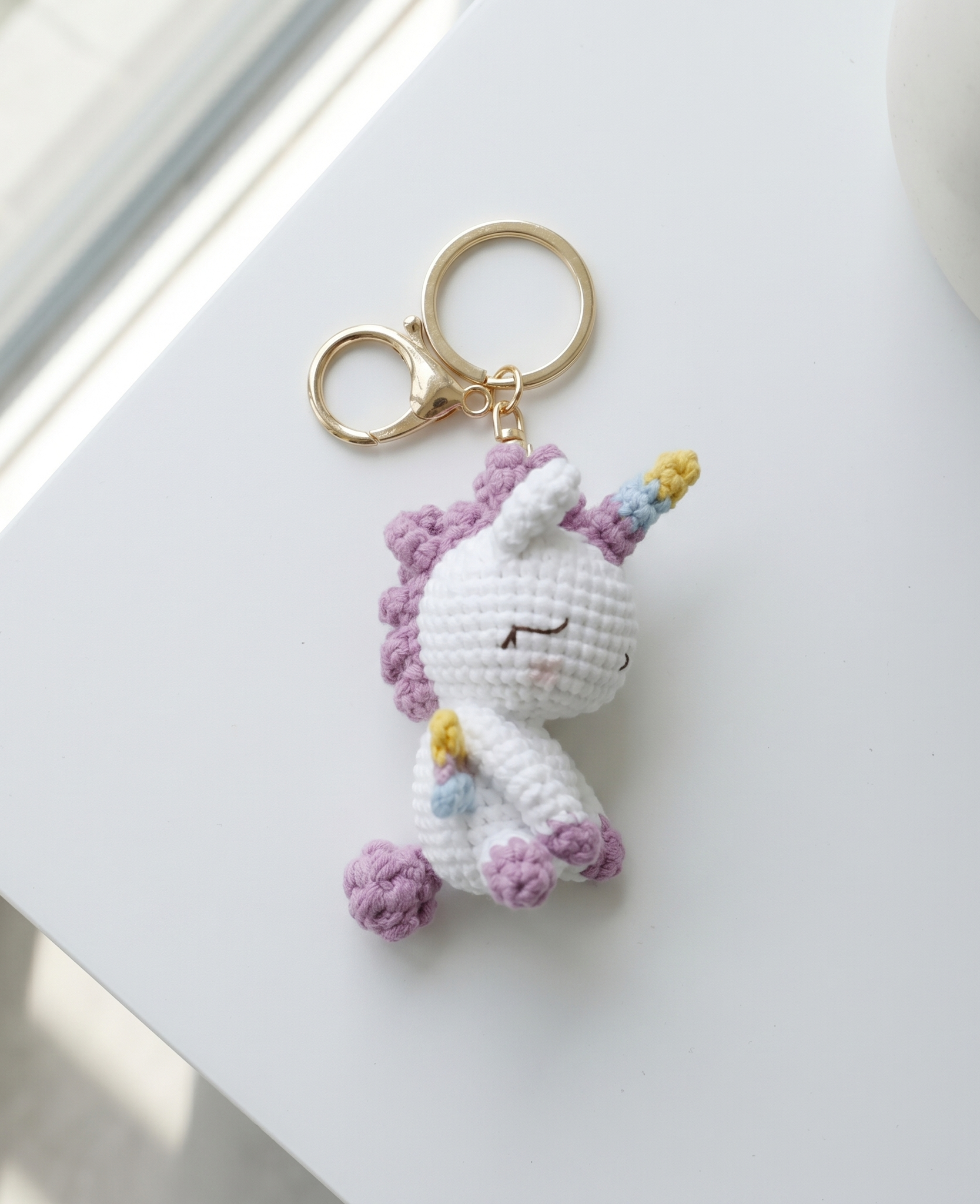 Crochet unicorn keyring showing horn and mane detail