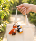 Handmade crochet puffin keyring with orange beak in soft yarn