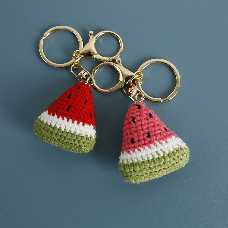 Handmade crochet watermelon keyring on plain background