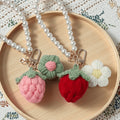 Handmade crochet strawberry keyring in red yarn