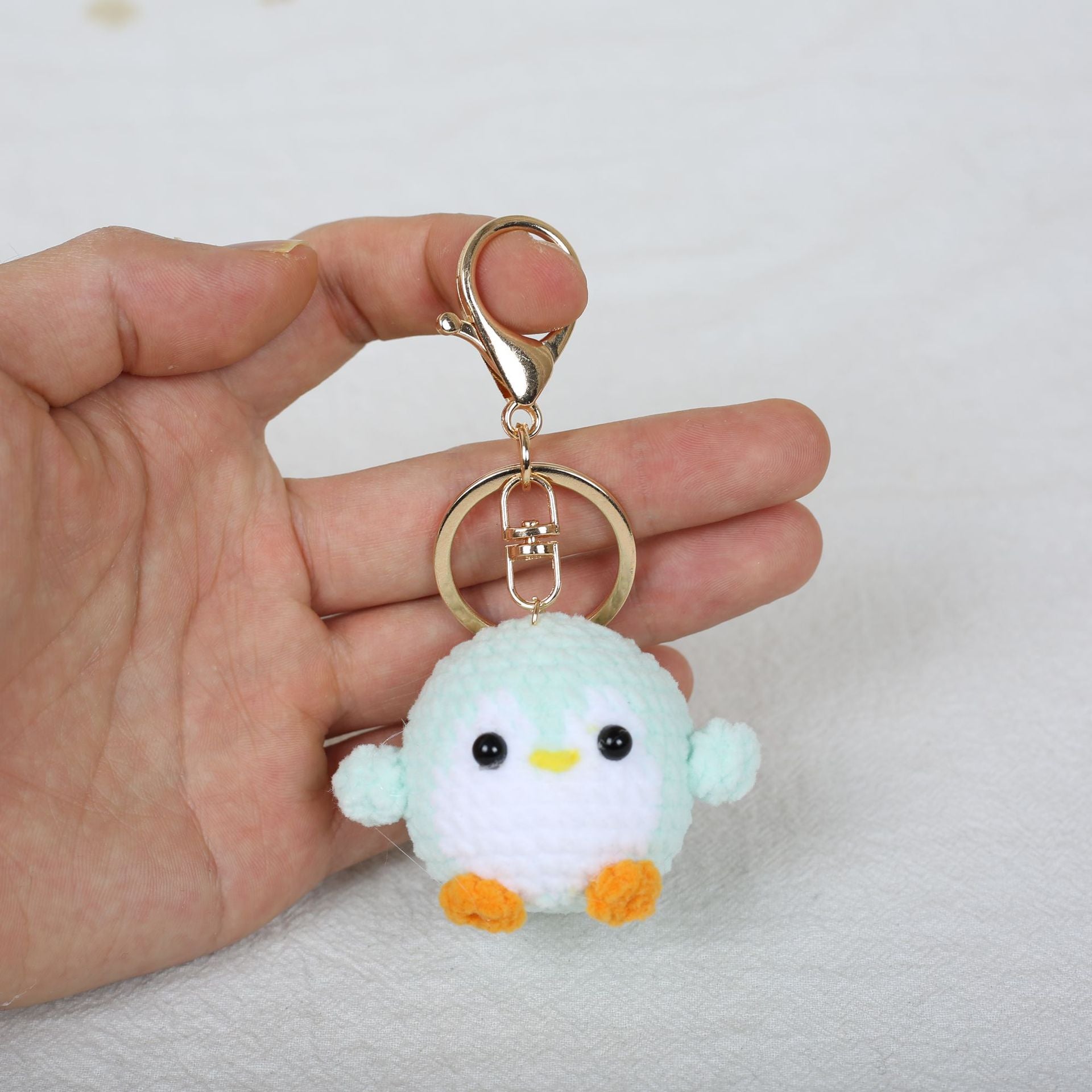 Crochet penguin keyring close-up detail