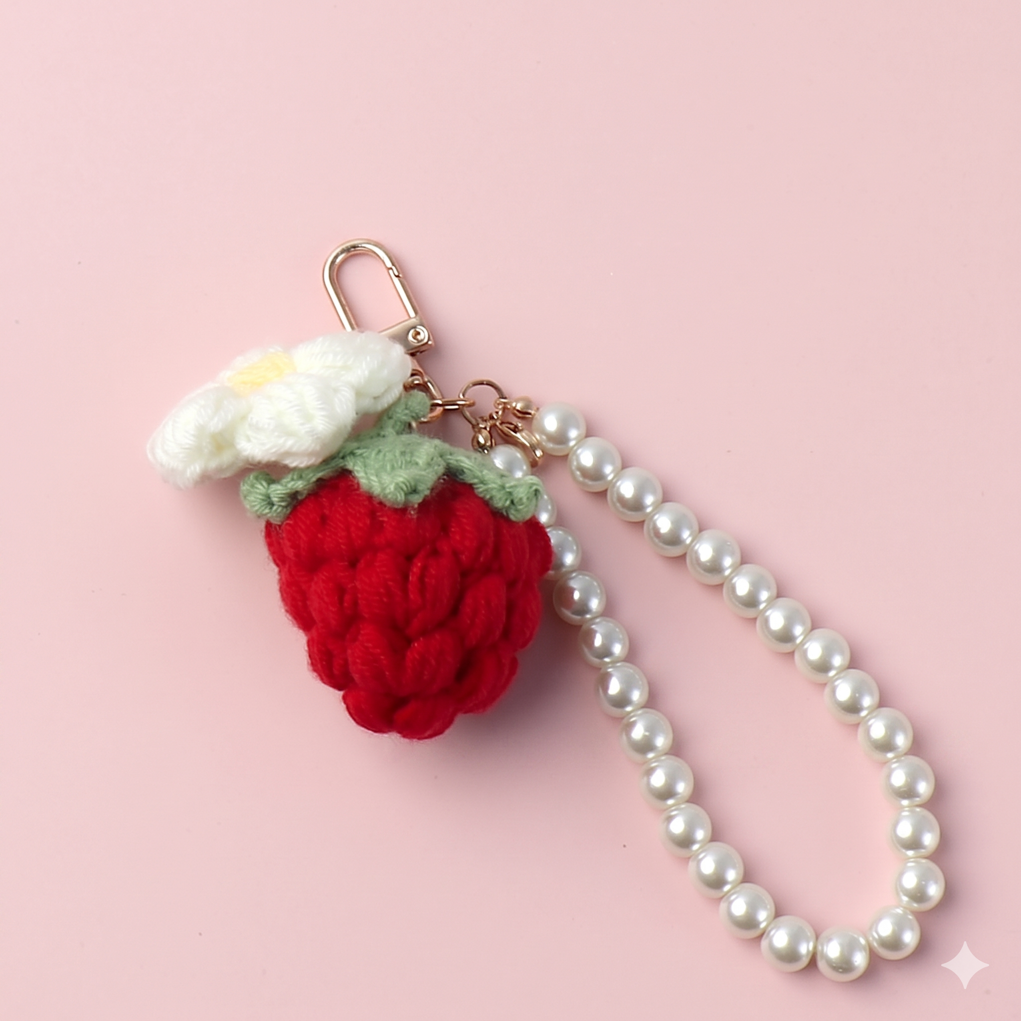 Crochet strawberry keyring close-up showing texture