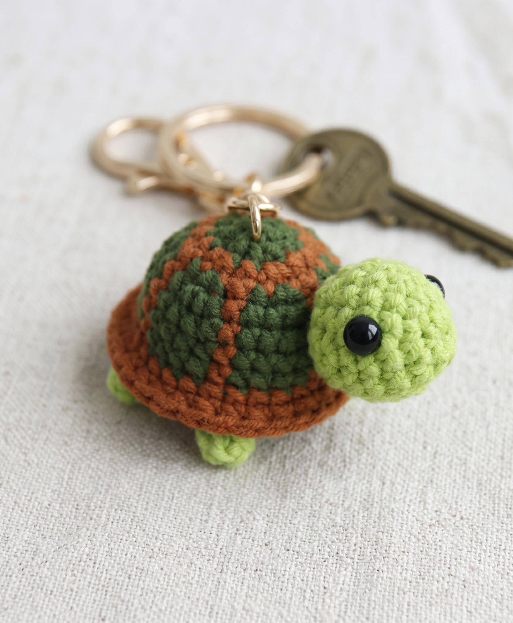 Crochet turtle keyring showing shell texture detail