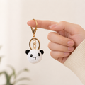 Handmade crochet panda head keyring in black and white yarn