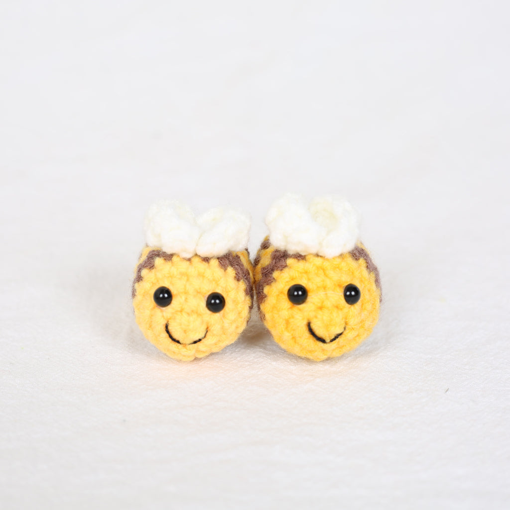 Close-up detail of handmade crochet bee keyring