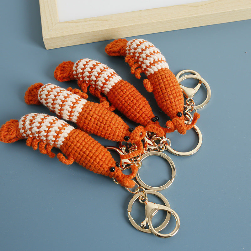 Crochet shrimp keyring showing curled body detail