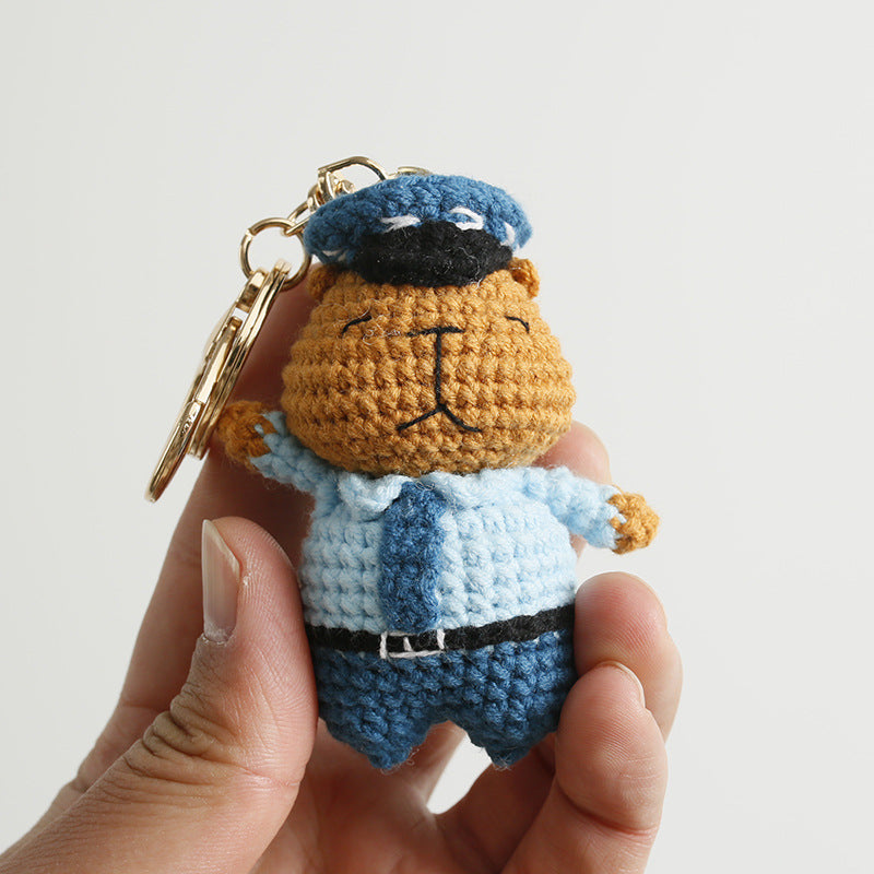 Handmade crochet capybara police officer keyring in soft yarn