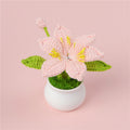 Handmade crochet lily plant in a small decorative pot