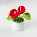 Handmade crochet calla lily plant in a small decorative pot