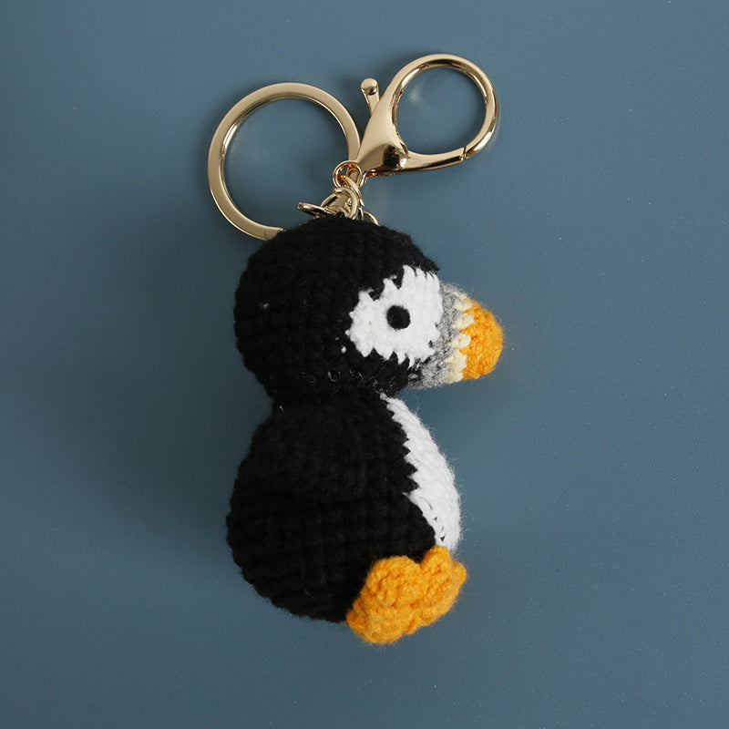 Crochet puffin keyring showing black and white body detail