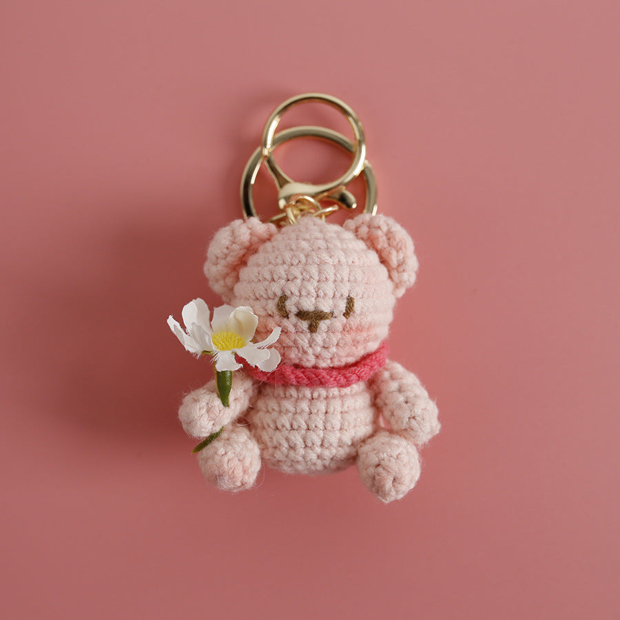 Handmade bear crochet keyring close-up showing embroidered face