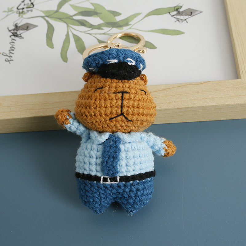 Crochet capybara police keyring showing uniform detail