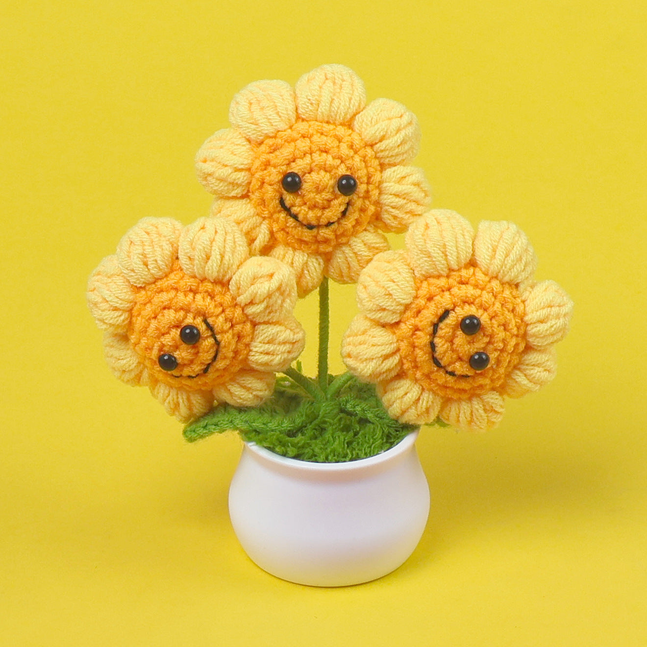 Handmade smiley sunflower crochet plant close-up detail