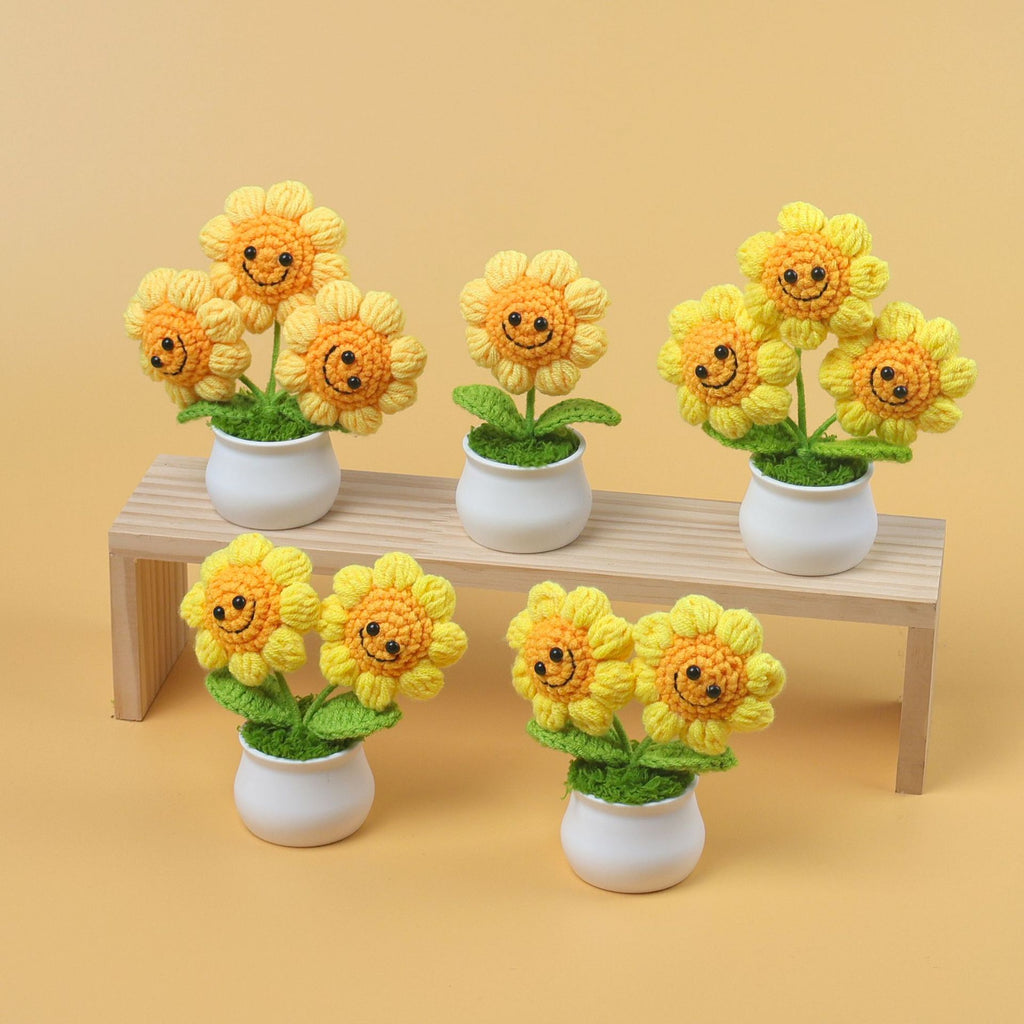Handmade crochet smiley sunflower plant in a small decorative pot