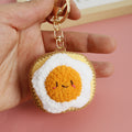 Handmade crochet toast keyring in golden yarn