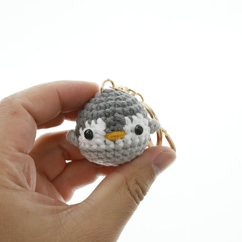 Crochet small penguin keyring close-up detail