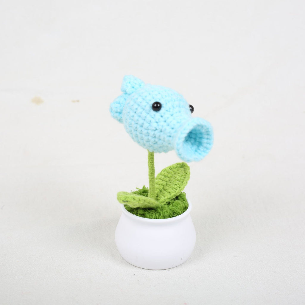Handmade peashooter crochet plant on display