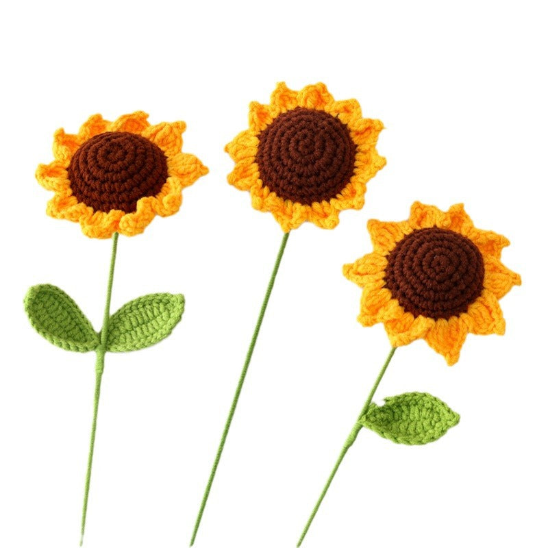 Handmade crochet sunflower flower stem on plain background