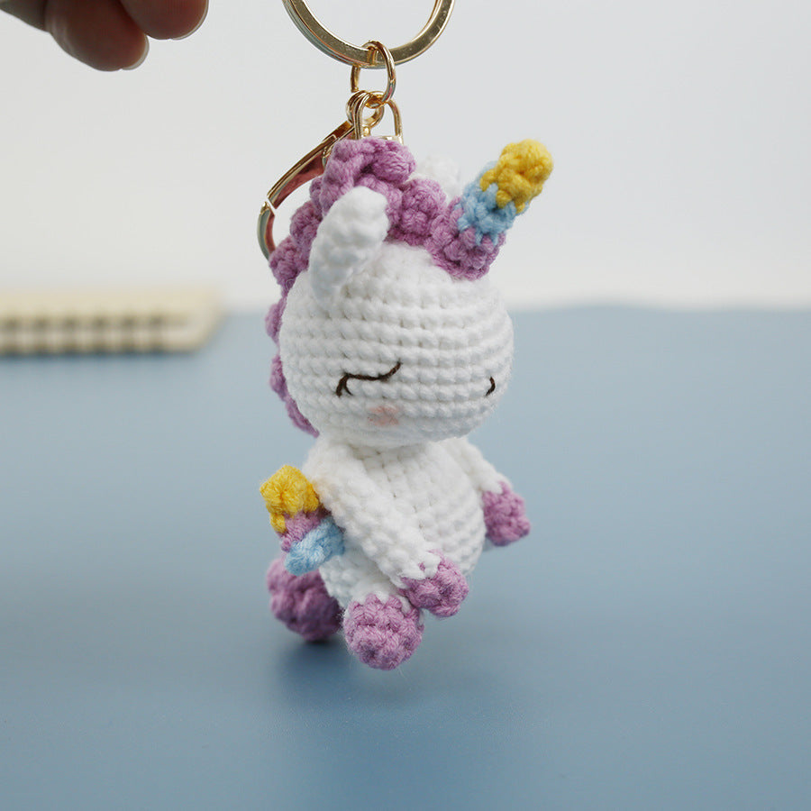 Handmade crochet unicorn keyring with rainbow mane in soft yarn