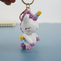 Handmade crochet unicorn keyring with rainbow mane in soft yarn