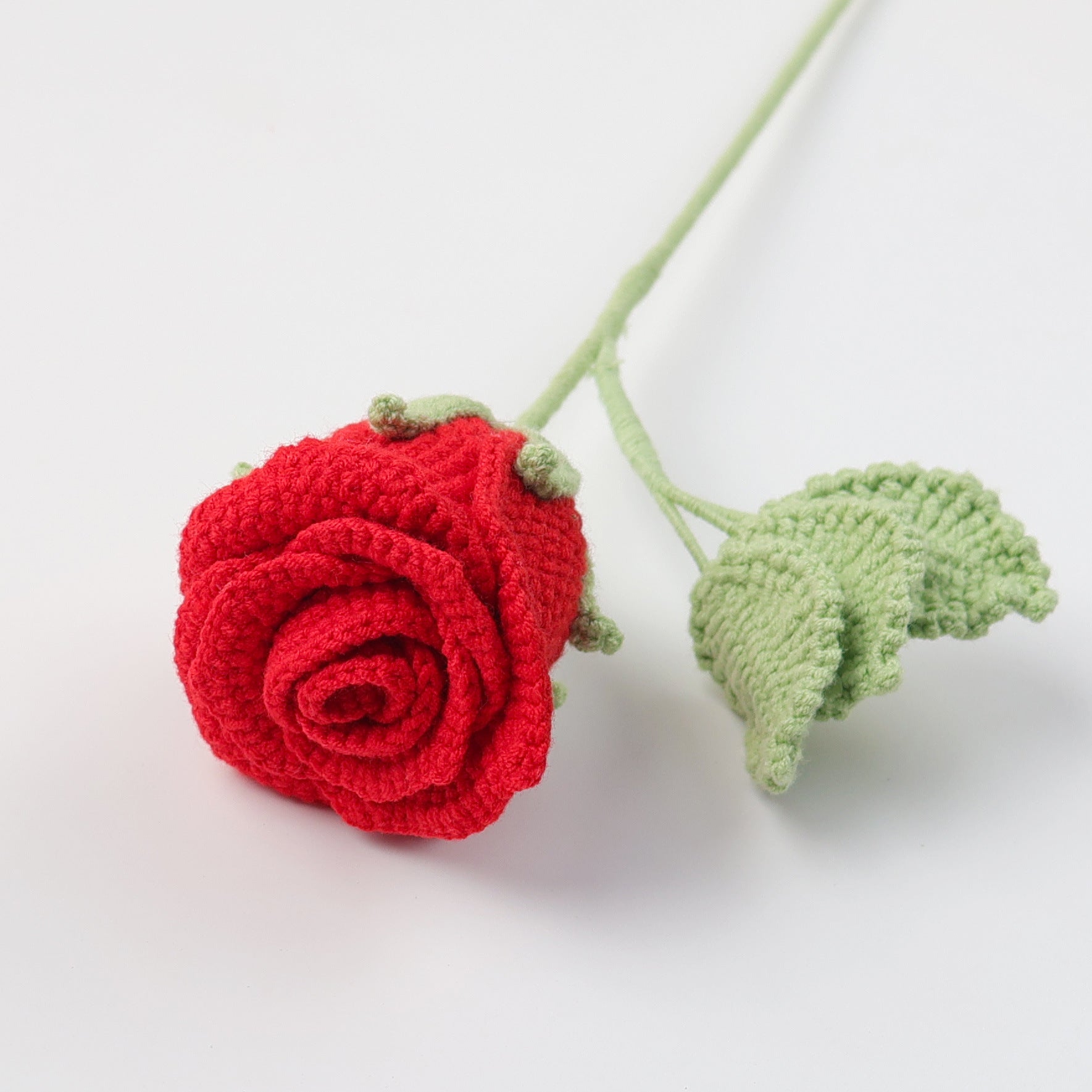 Handmade crochet rose presented in a miniature wine glass
