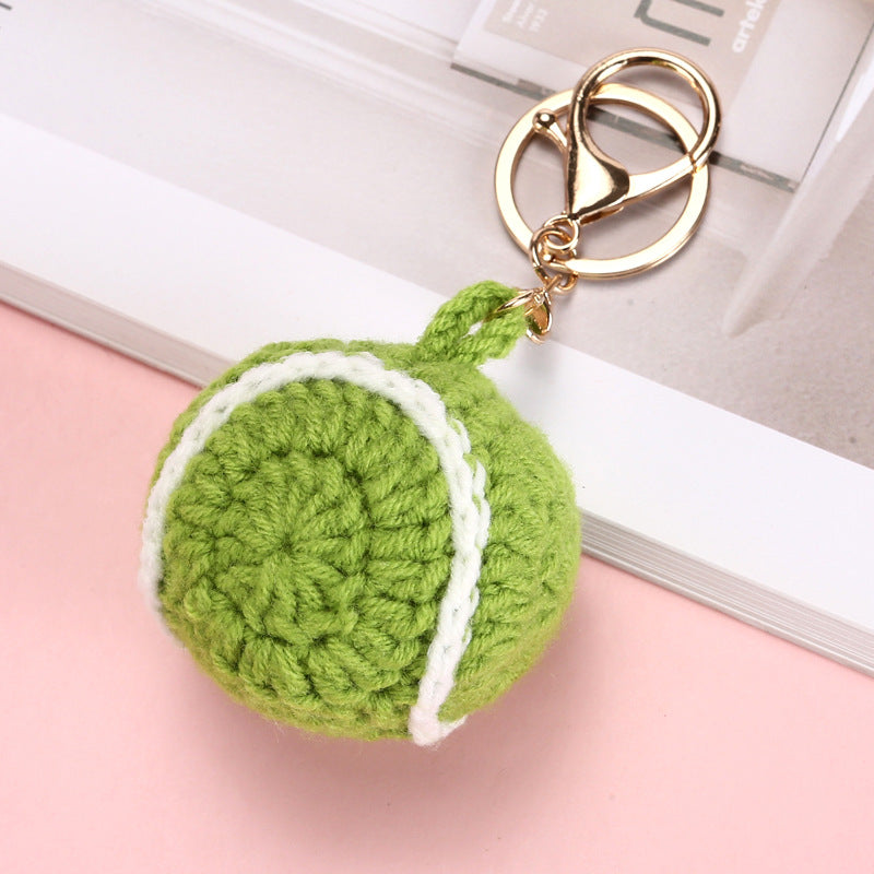 Crochet tennis ball keyring showing seam detail