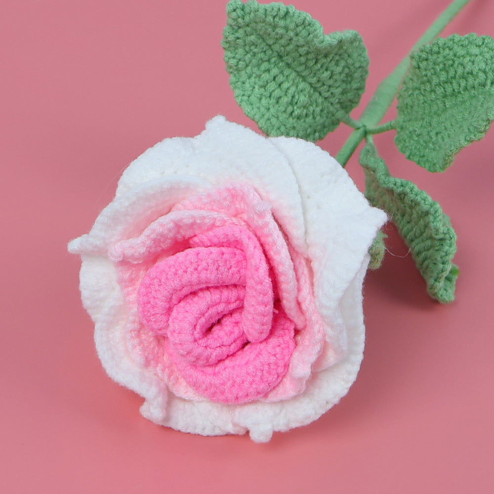 Handmade large crochet rose flower stem on plain background