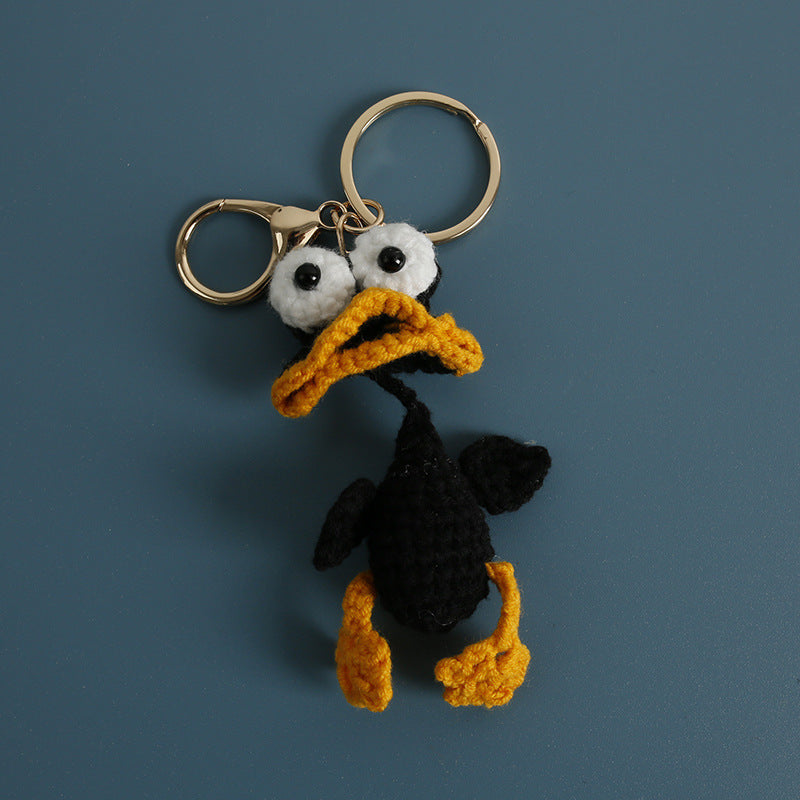 Handmade derpy duck crochet keyring close-up showing expression