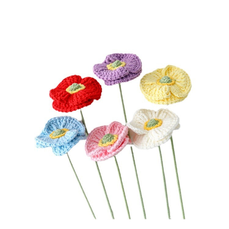 Crochet small poppy stem on plain background