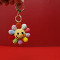 Large handmade crochet rainbow flower keyring in multicolour yarn