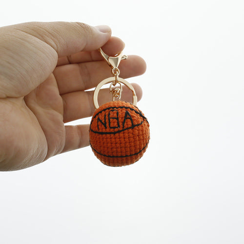 Handmade crochet basketball keyring in orange and black yarn
