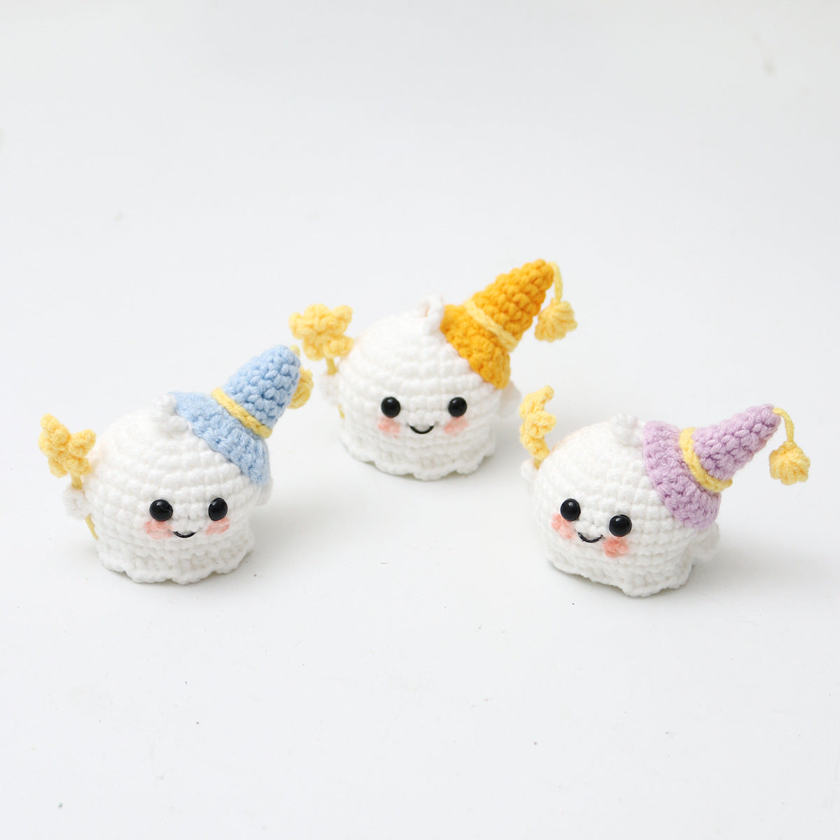 Crochet ghost keyring showing moody embroidered expression