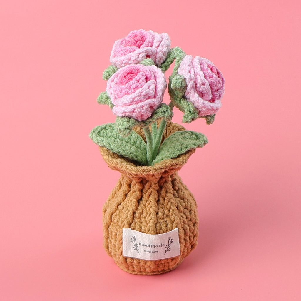 Handmade rose crochet plant pot on display