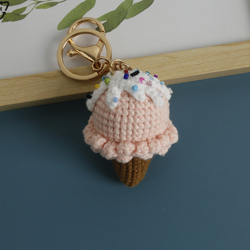 Handmade crochet ice cream keyring on plain background