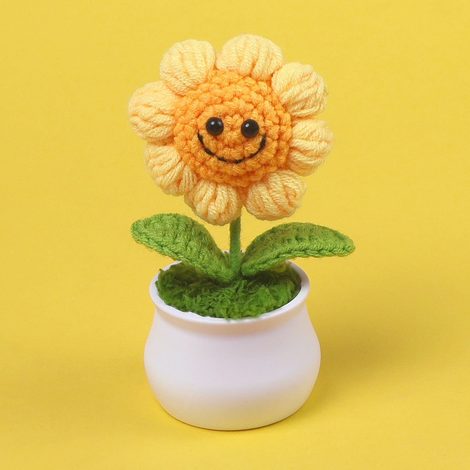 Crochet smiley sunflower plant pot on display