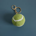 Handmade crochet tennis ball keyring in yellow yarn