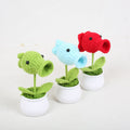 Handmade crochet peashooter plant in a small decorative pot