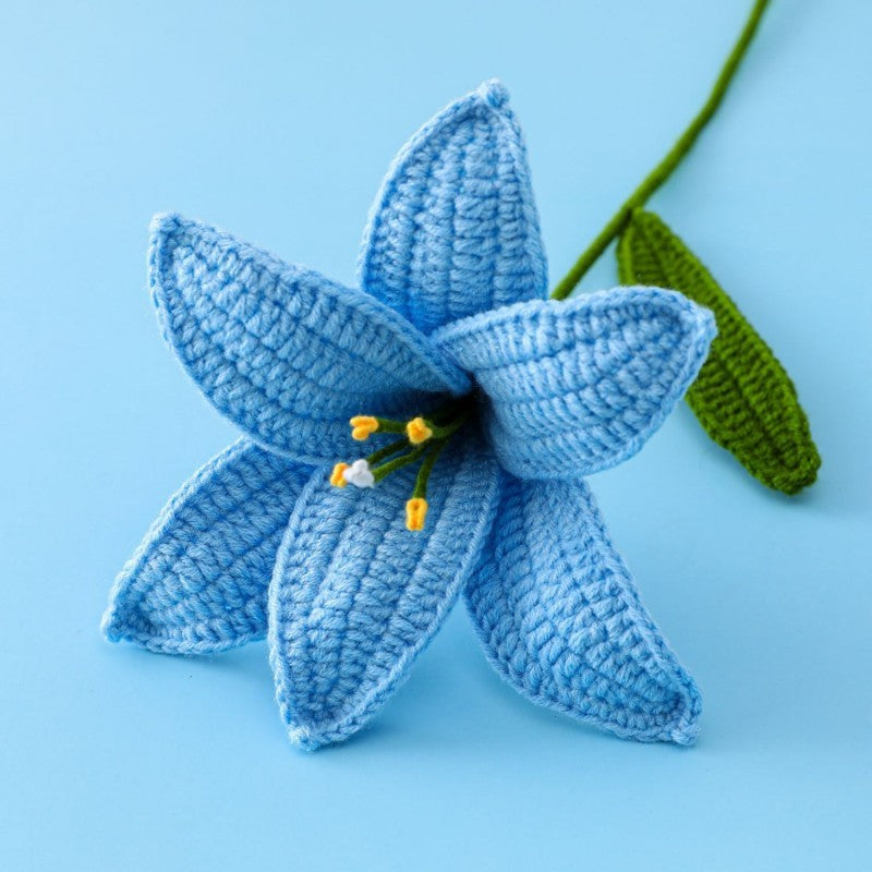 Handmade crochet lily flower stem on plain background