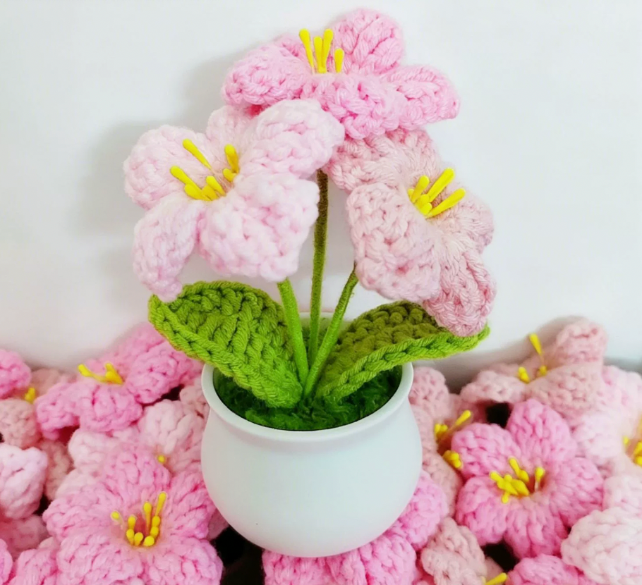 Crochet bell flower pot close-up showing drooping bell blooms