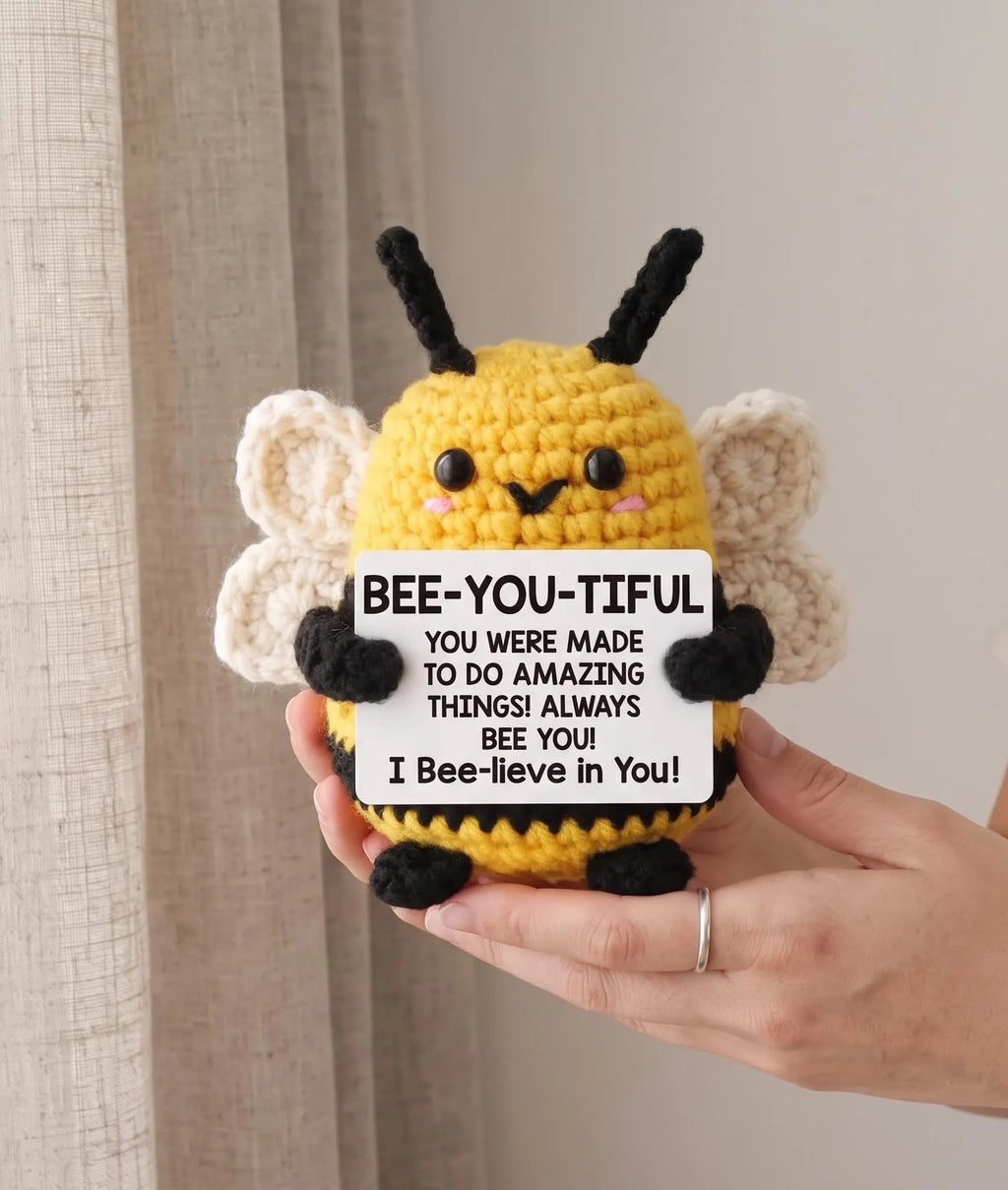 Crochet bee plushie in yellow and black yarn